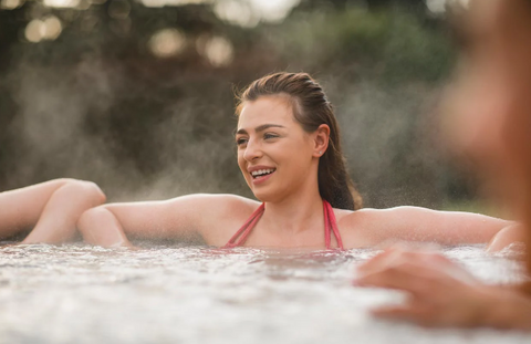 Woman in cold plunge pool